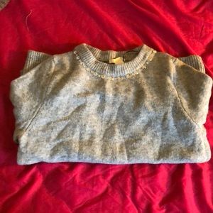 Grey sweater with embezzles neck line